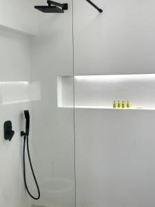 a bathroom with a shower with a shower head at AESIS in Krokos +47 photos