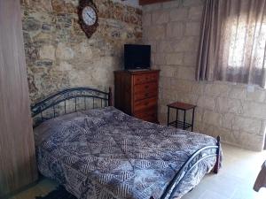 Postel nebo postele na pokoji v ubytování TRADITIONAL HOUSE ARSOS