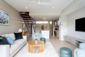 a living room with a couch and a table at Dunn Bay Apartment 6 in Dunsborough