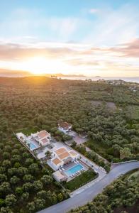 an aerial view of a large mansion with a road at White Stone Villa Hesperia - Poolside Escape Close to Laganas Beach in Lithakia
