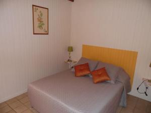 En eller flere senge i et værelse på Le Pinot - Gîte - Lot - Vallée de la Dordogne