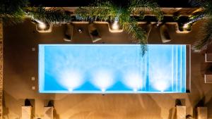 a large screen with lights on top of a building at White Stone Luxury Villa in Lithakia