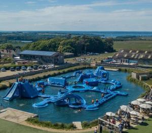 a group of water slides in a water park at Poachers Lodge At Tapnell Farm in Yarmouth