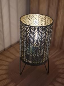 a wicker chair sitting on top of a wooden floor at Ferienwohnung BUTTERBLUME, Feldberg - Haus Wiesenquelle in Feldberg +49 photos