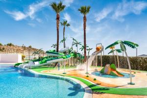 a pool with a water park with a water slide at Melia Villaitana in Benidorm