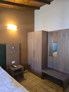 Voodi või voodid majutusasutuse Albergo Al Gambero toas