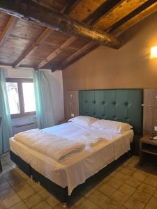Voodi või voodid majutusasutuse Albergo Al Gambero toas