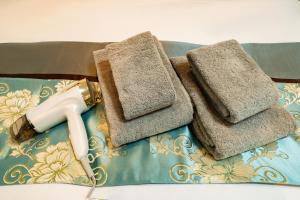 a pair of towels and a blow dryer on a table at 84-5, Shiomi 301, Entire room for rent in Tokyo