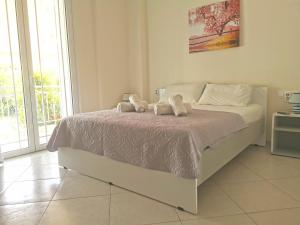 Krevet ili kreveti u jedinici u okviru objekta Lefkada SunCentral Apartments
