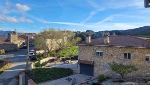 a house in a village with a street at Alma de Gredos in Ávila