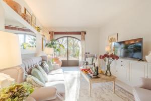 a living room with a couch and a table at Villa Amore, a Romantic Hilltop Farmhouse in Lucca in Lucca