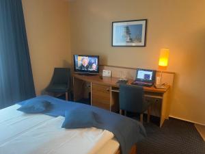 TV a/nebo společenská místnost v ubytování Atrium Hotel Krüger