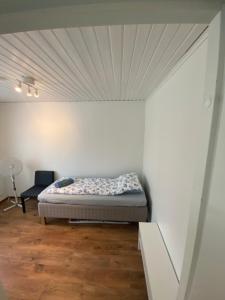 a bed in a room with a ceiling at Big Duplex, 15min to Turku or Naantali in Turku