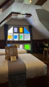 The Twenty Lodge- SHA Extra Plus tesisinde bir odada yatak veya yataklar