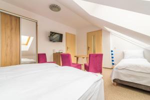 Postel nebo postele na pokoji v ubytování Magnolia pokoje i apartamenty Dębki