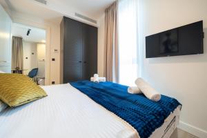 TV a/nebo společenská místnost v ubytování Invictus Hotel