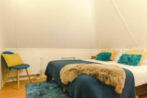 Katil atau katil-katil dalam bilik di Holiday home with sauna