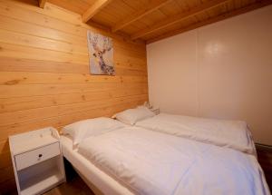 Un pat sau paturi într-o cameră la Natuurhuisje aan Duinrand