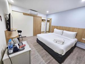 Postel nebo postele na pokoji v ubytování Beyond 21 Hotel