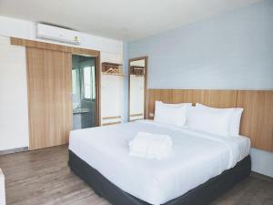 Postel nebo postele na pokoji v ubytování Beyond 21 Hotel