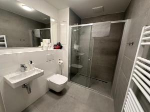 A bathroom at Bella Apartments Brno