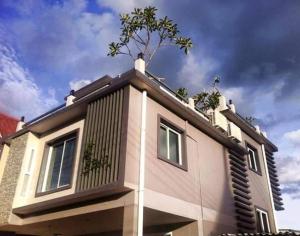 a house with a tree on the top of it at Hua-Hin Beach Villa บ้านพักริมทะเลหัวหิน in Hua Hin