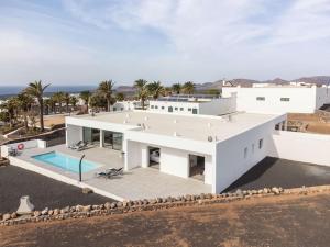 an aerial view of a white house with a swimming pool at Casa Lero in Las Breñas