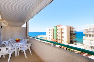 a balcony with a table and chairs and the ocean at PARADIS 2 Planet Costa Dorada in Salou