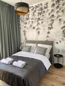 Ένα ή περισσότερα κρεβάτια σε δωμάτιο στο Apartament Kościuszki