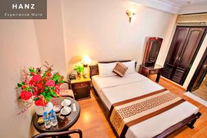 En eller flere senge i et værelse på Thanh Thu Hotel