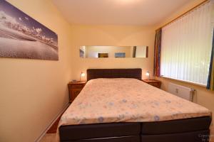 Postel nebo postele na pokoji v ubytování Haus "Luv und Lee" Appartement LUV32