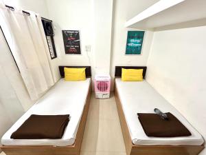 Ліжко або ліжка в номері Procida Hostel by Vibe Village