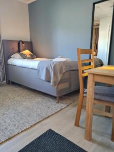 Voodi või voodid majutusasutuse Lofoten Værøy Bryggehotell AS toas