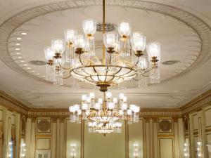 a large chandelier hanging from a ceiling at Fairmont Hotel Vancouver in Vancouver