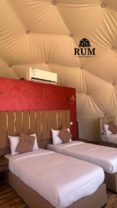 a room with two beds in a tent at Rum desert magic in Wadi Rum
