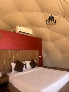 a bedroom with a bed in a tent at Rum desert magic in Wadi Rum