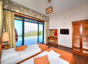 Ένα ή περισσότερα κρεβάτια σε δωμάτιο στο Villa Monte Telmesos +22 φωτογραφίες