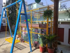 a large bird cage on a swing at Ram Madaiya Home stay in Faizābād