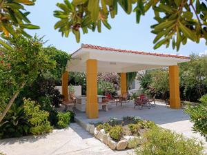 A garden outside Villa On The Beach Spiaggia Plaia