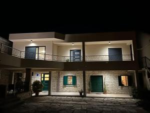 a house at night with a balcony on it at Apartment Mate in Pridraga