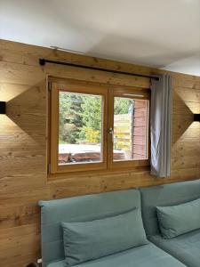 Posezení v ubytování Chalets du Bouchot & Jacuzzi privatif proximité Gerardmer & La Bresse