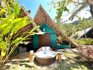 a house with a tub in front of it at Buko Beach Resort in El Nido
