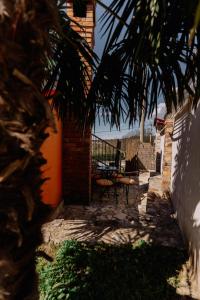 a patio with a table and chairs on a balcony at Sweet room with a terrace in Roč