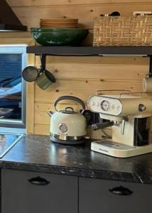 a tea kettle on a counter in a kitchen at Zillya Club in Tatariv