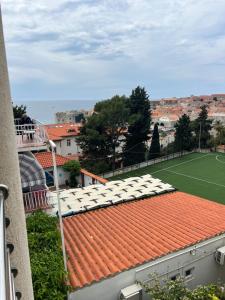 a view of a tennis court from the roof of a building at Apartments Romano in Dubrovnik