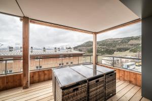 a balcony with a view of the mountains at Apartment Epicea Alpe d'Huez - by EMERALD STAY in L'Alpe-d'Huez