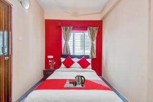 Giường trong phòng chung tại OYO Prasad Inn