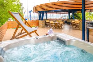 a hot tub on the deck of a cruise ship at Sekli Panzió in Balatonlelle