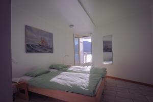 a bedroom with a bed and a window at Villa Acapulco App 4044 in Moscia