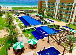 an overhead view of a pool at a resort at VG FUN Praia do Futuro Pé na Areia ap 311 IMOB TEMPORADA in Fortaleza
